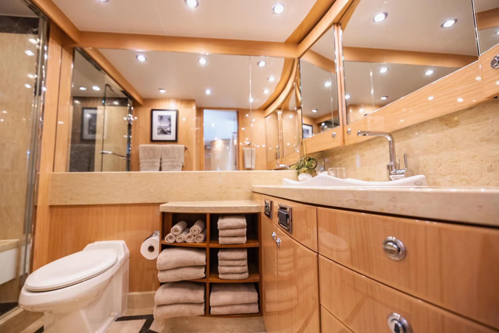 a bathroom with a large mirror aboard PINGUINITO Yacht for Sale