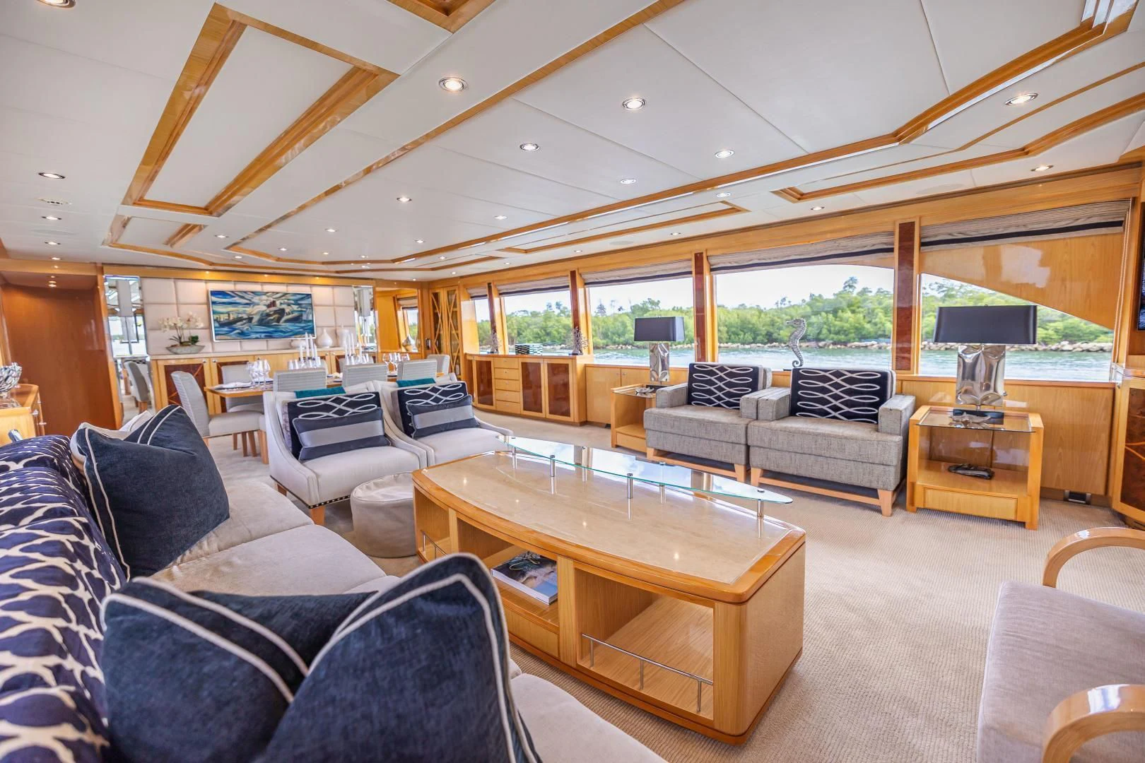 a living room with a large window aboard PINGUINITO Yacht for Sale
