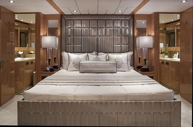 a large bed in a hotel room aboard PINGUINITO Yacht for Sale