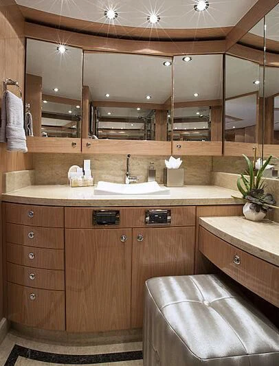 a bathroom with a large mirror aboard PINGUINITO Yacht for Sale