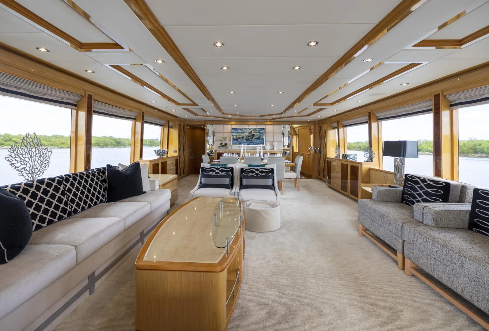 a living room with a couch and a table aboard PINGUINITO Yacht for Sale
