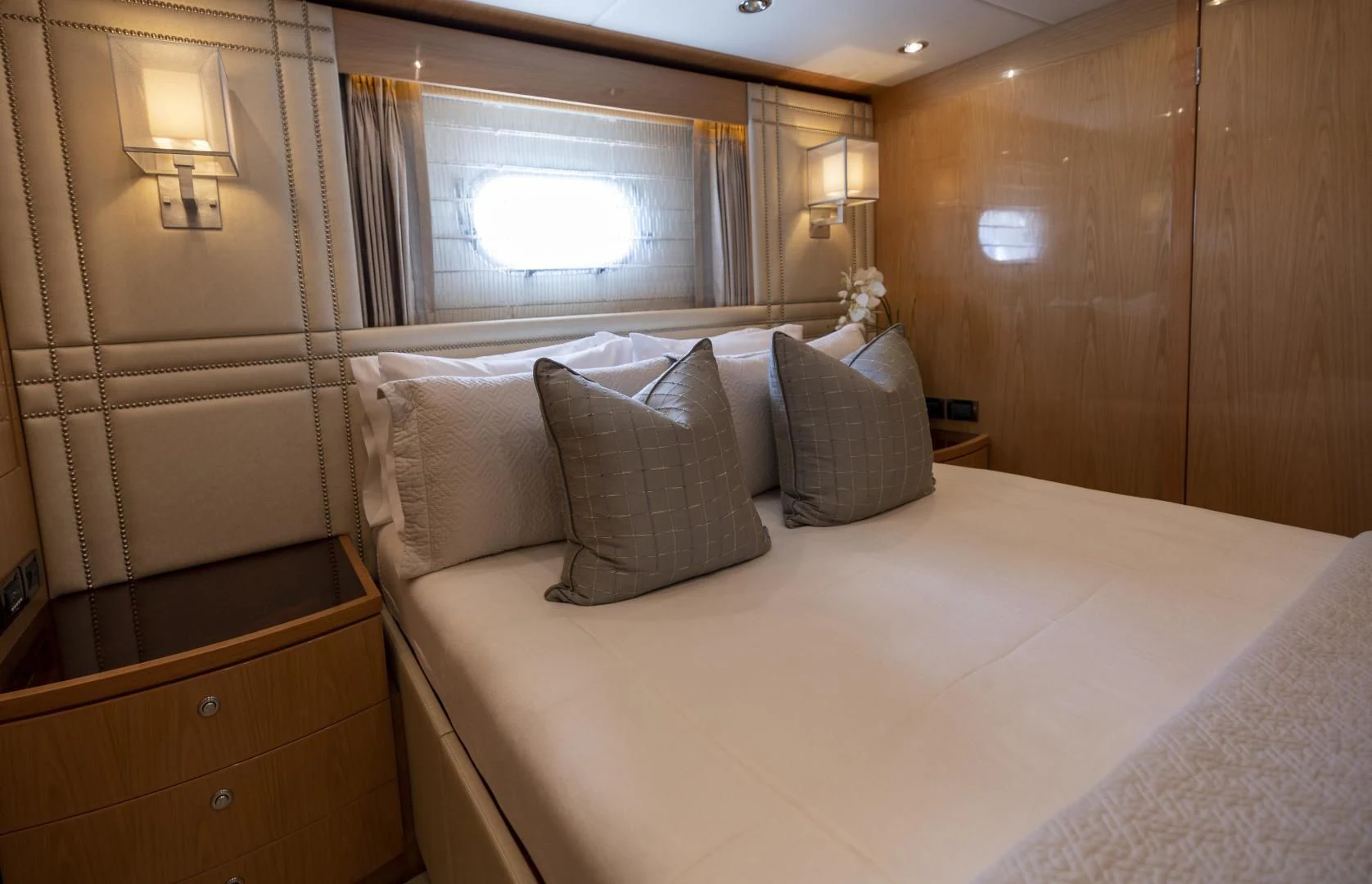 a bed with pillows aboard PINGUINITO Yacht for Sale