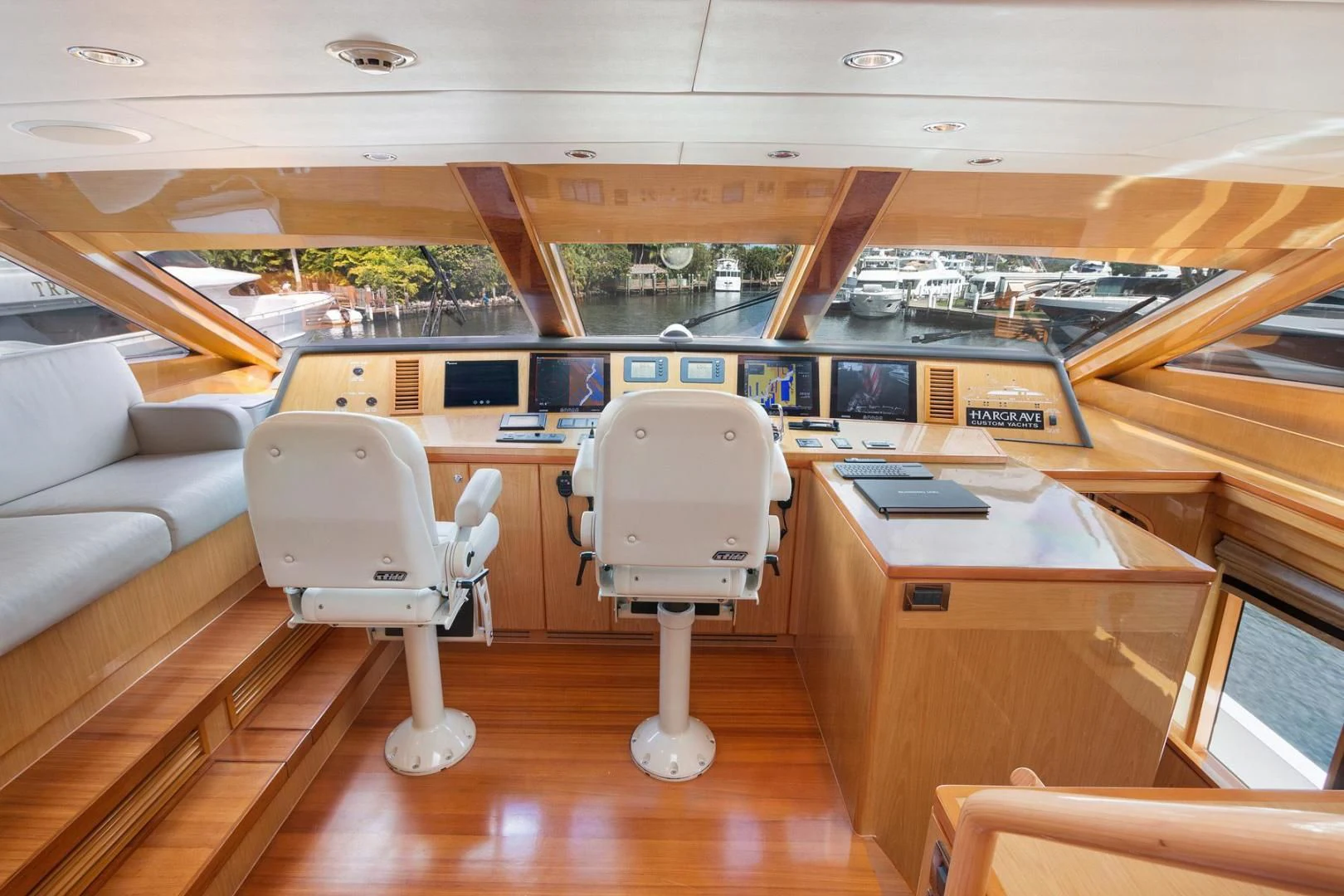 a room with chairs and tables aboard PINGUINITO Yacht for Sale