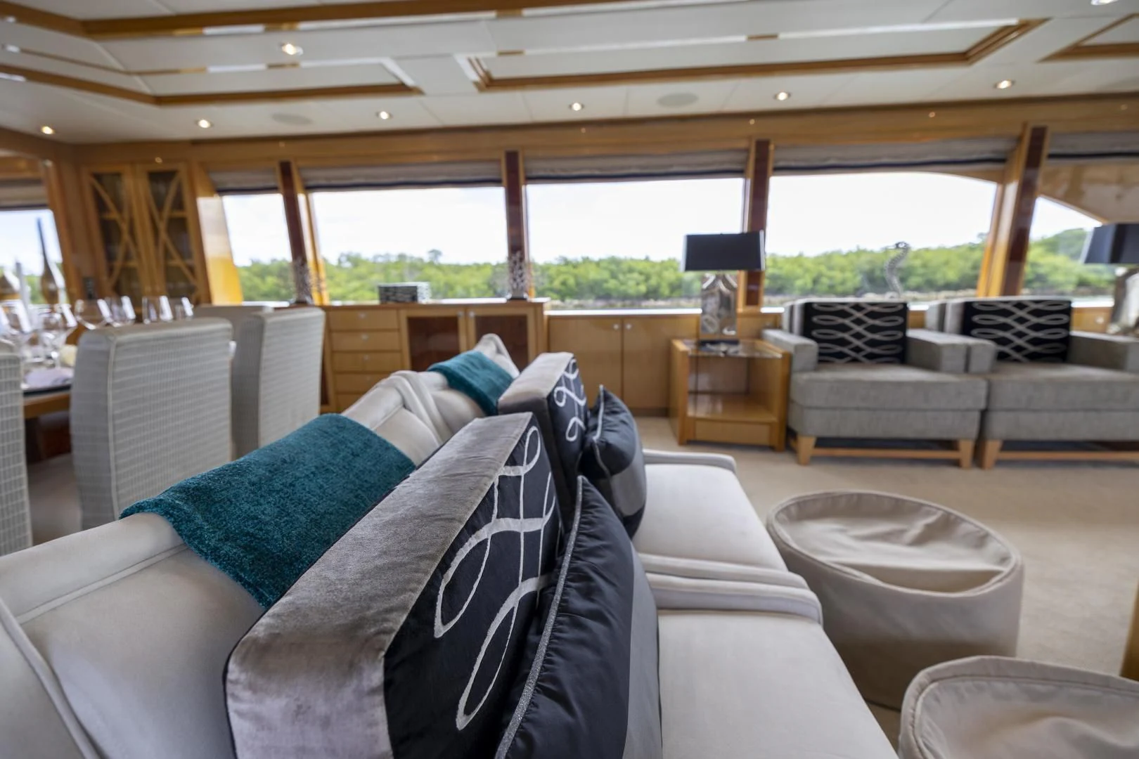 a living room with a large window aboard PINGUINITO Yacht for Sale