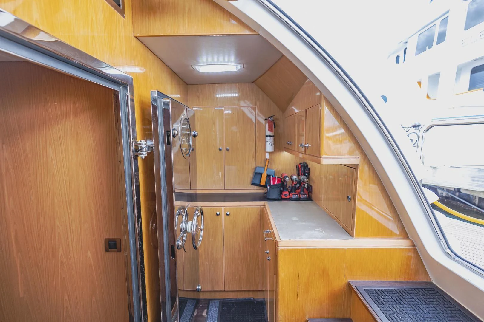 a room with wooden cabinets aboard PINGUINITO Yacht for Sale