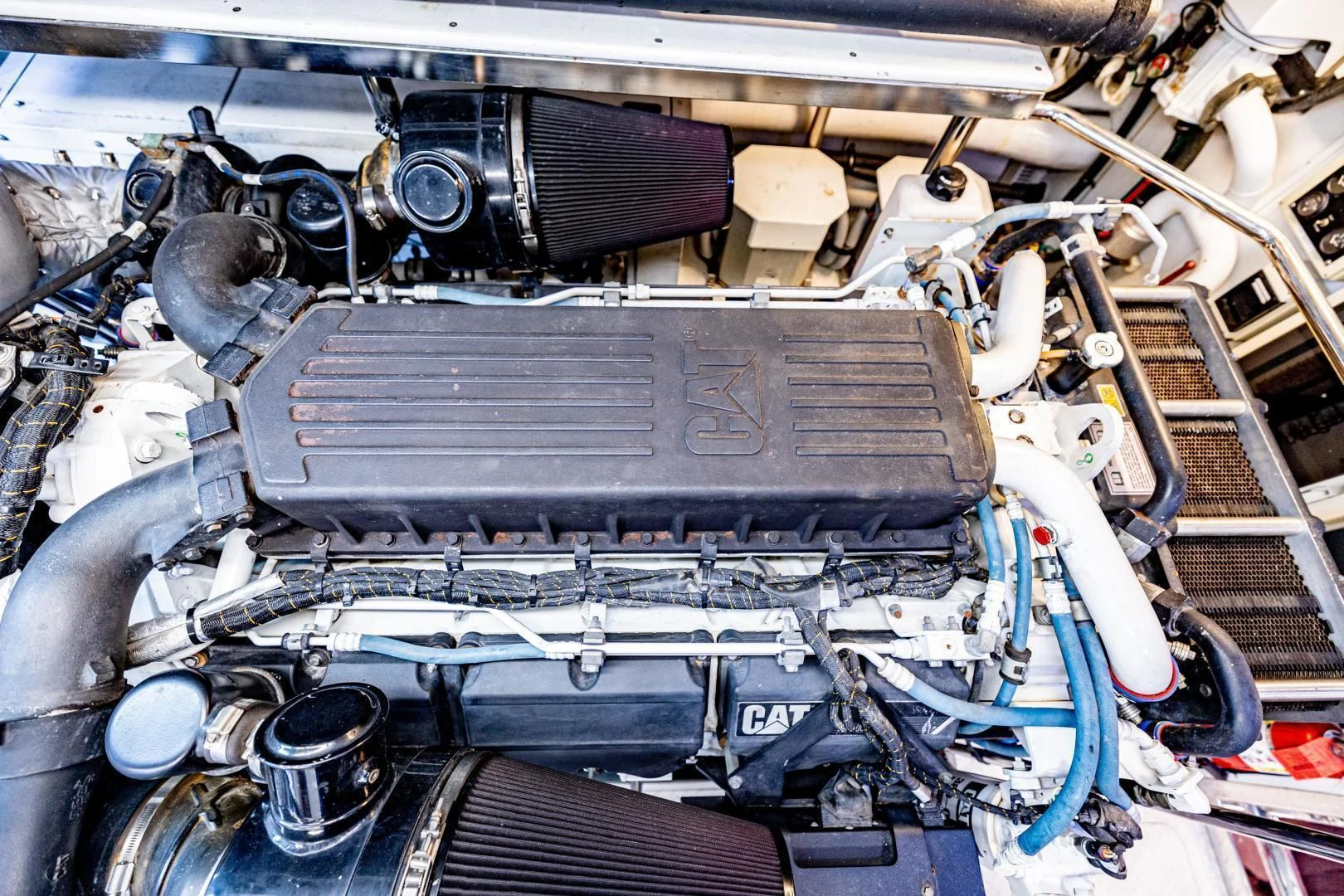 a car engine with a blue hood aboard PINGUINITO Yacht for Sale