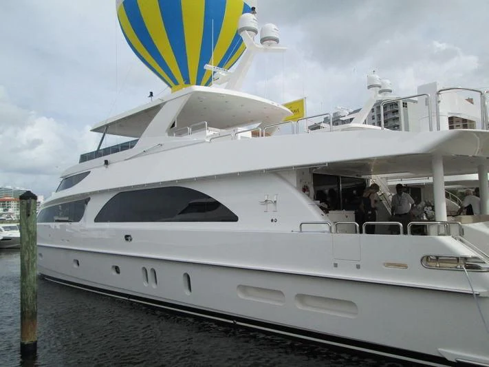 a white yacht with people on it aboard PINGUINITO Yacht for Sale