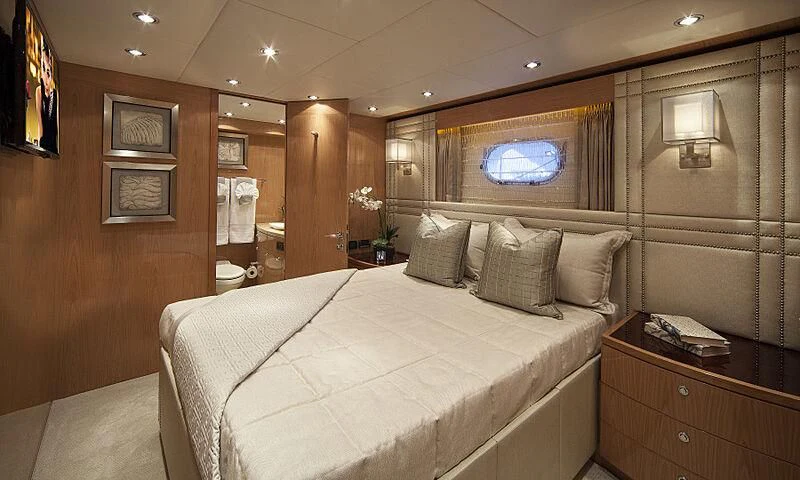 a bed in a room aboard PINGUINITO Yacht for Sale