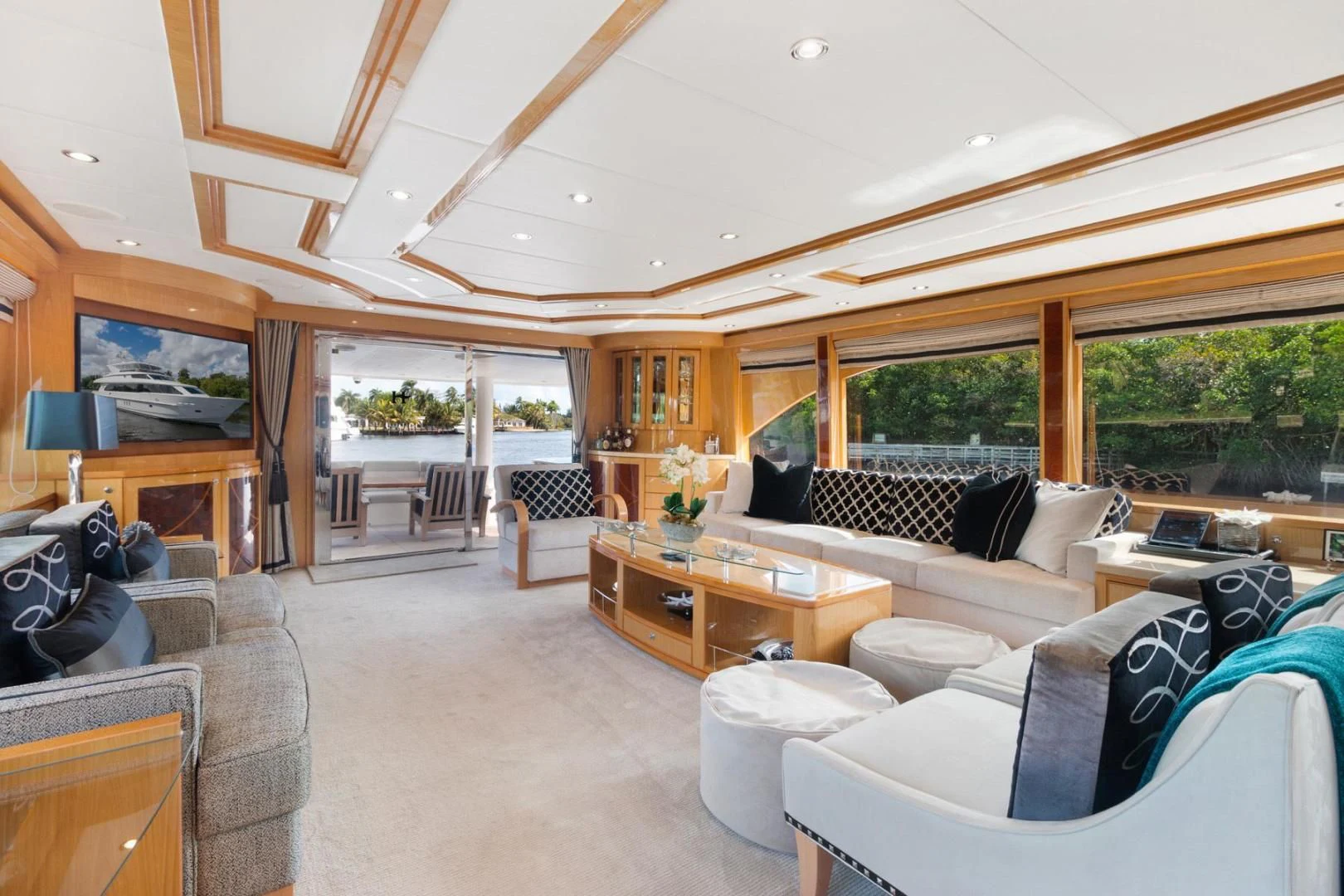a living room with a large open window aboard PINGUINITO Yacht for Sale