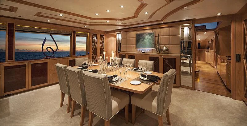 a large conference room with a table and chairs aboard PINGUINITO Yacht for Sale