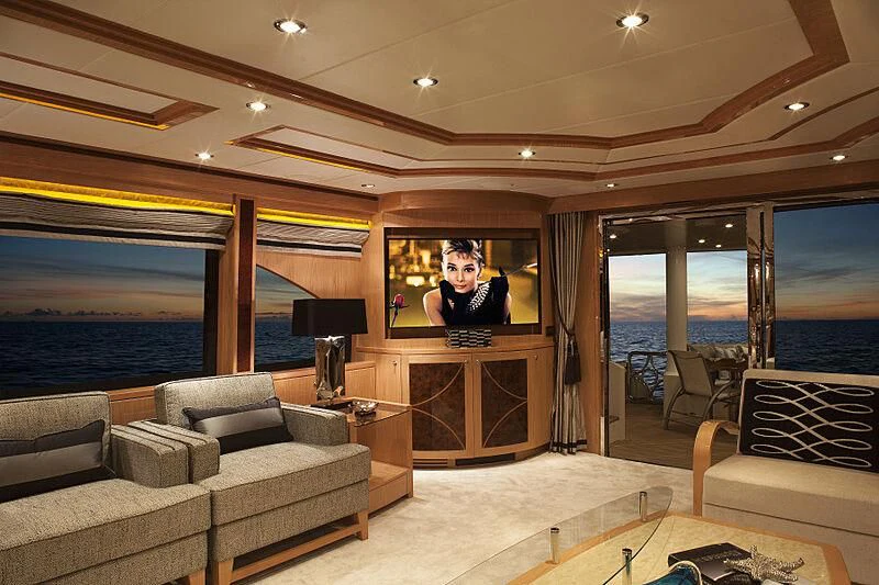 a living room with a large tv aboard PINGUINITO Yacht for Sale