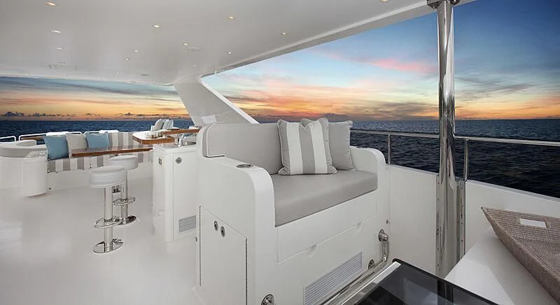 a room with a couch and a table and chairs aboard PINGUINITO Yacht for Sale