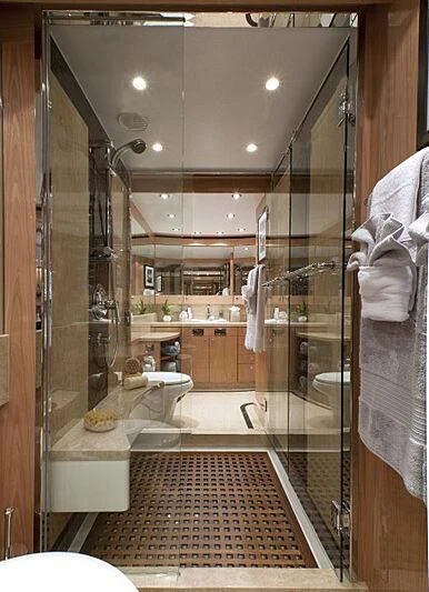 a bathroom with a large glass shower aboard PINGUINITO Yacht for Sale