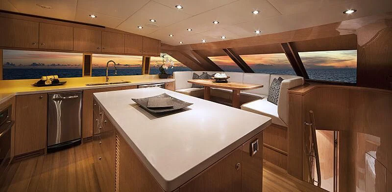 a kitchen with a large island aboard PINGUINITO Yacht for Sale