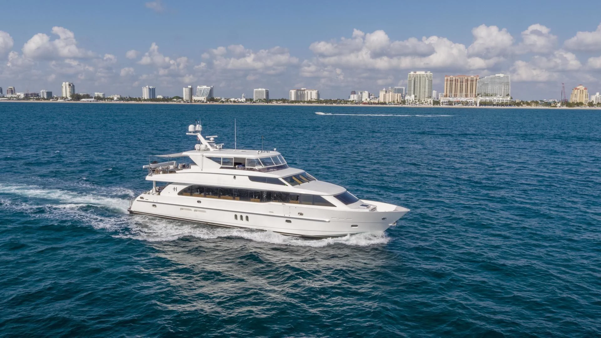 a white boat in the water aboard PINGUINITO Yacht for Sale