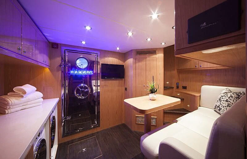 a room with a bed and a table aboard PINGUINITO Yacht for Sale