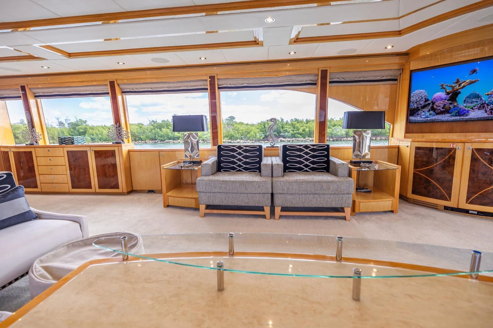 a living room with a pool table aboard PINGUINITO Yacht for Sale