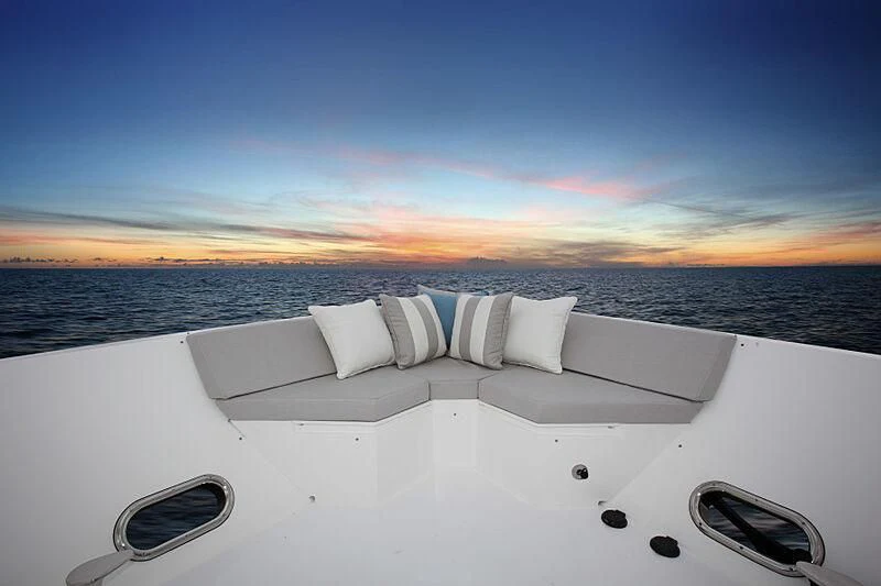 a white bed on a boat aboard PINGUINITO Yacht for Sale