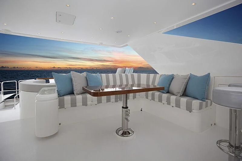 a room with a bed and a table aboard PINGUINITO Yacht for Sale