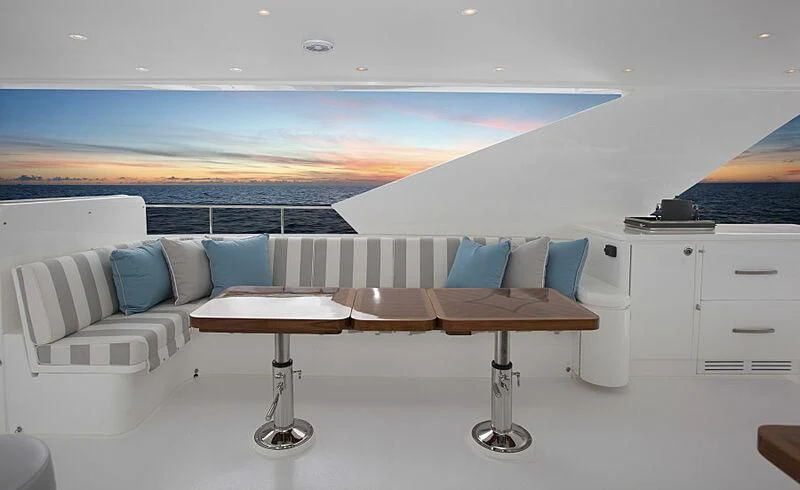 a room with a couch and a table aboard PINGUINITO Yacht for Sale