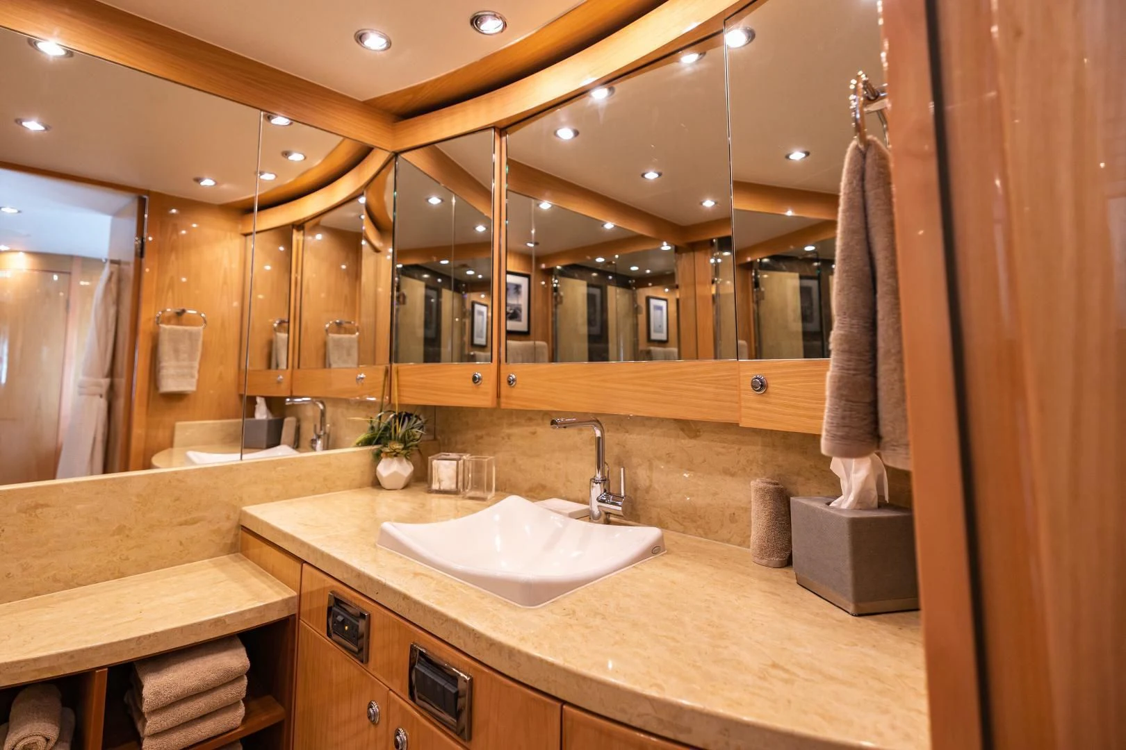 a bathroom with a large mirror aboard PINGUINITO Yacht for Sale