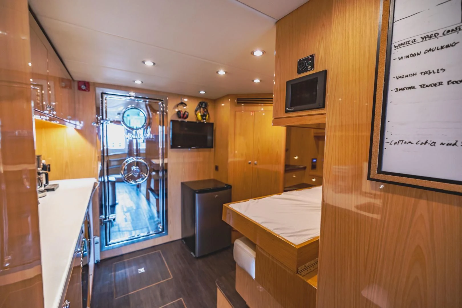 a bathroom with a countertop sink and a large window aboard PINGUINITO Yacht for Sale