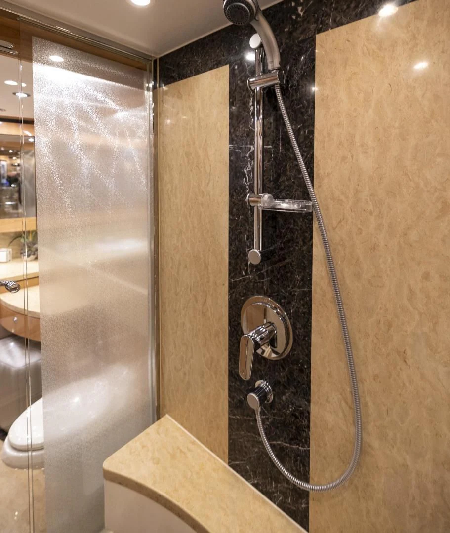 a shower with a glass door aboard PINGUINITO Yacht for Sale
