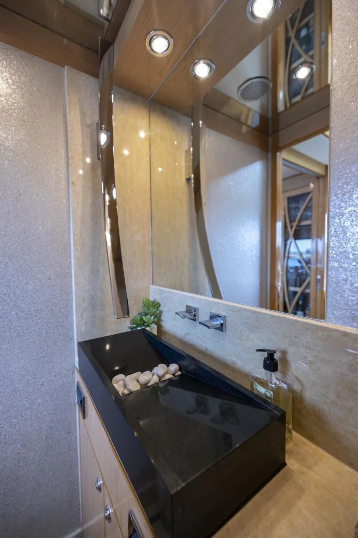 a bathroom with a marble counter aboard PINGUINITO Yacht for Sale