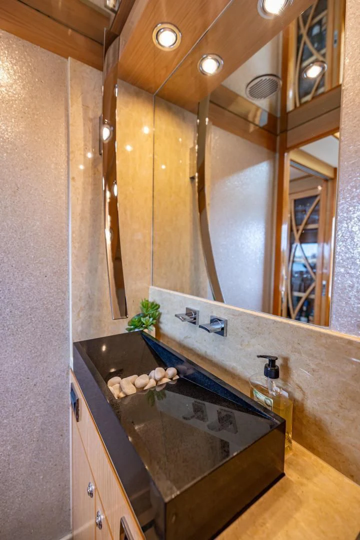 a bathroom with a marble counter aboard PINGUINITO Yacht for Sale