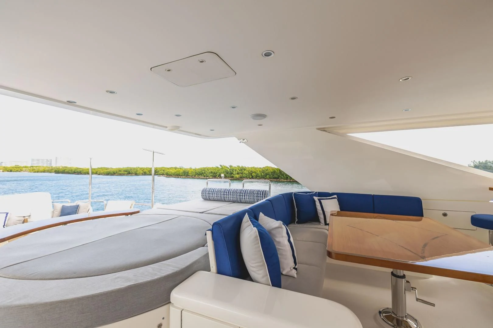 a room with a bed and a pool aboard PINGUINITO Yacht for Sale