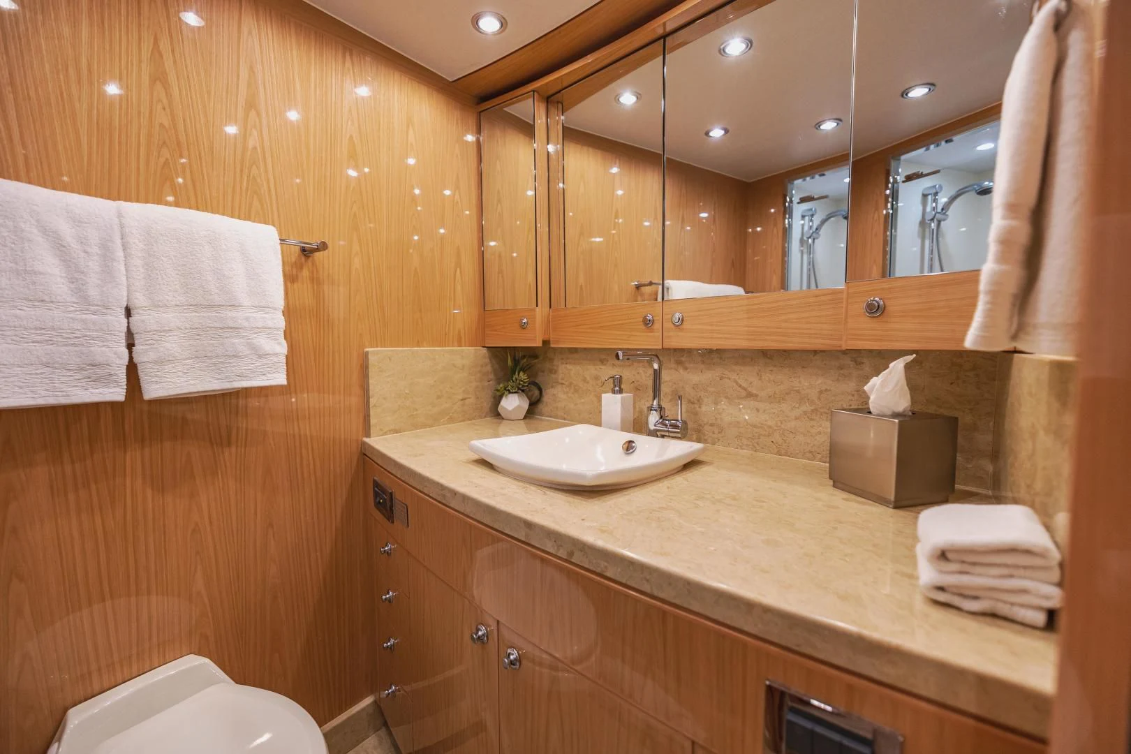 a bathroom with a large mirror aboard PINGUINITO Yacht for Sale