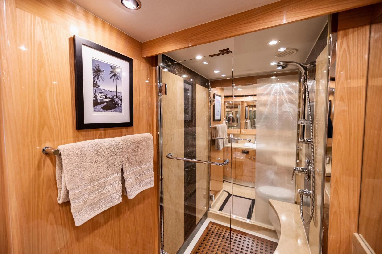 a bathroom with a glass shower aboard PINGUINITO Yacht for Sale