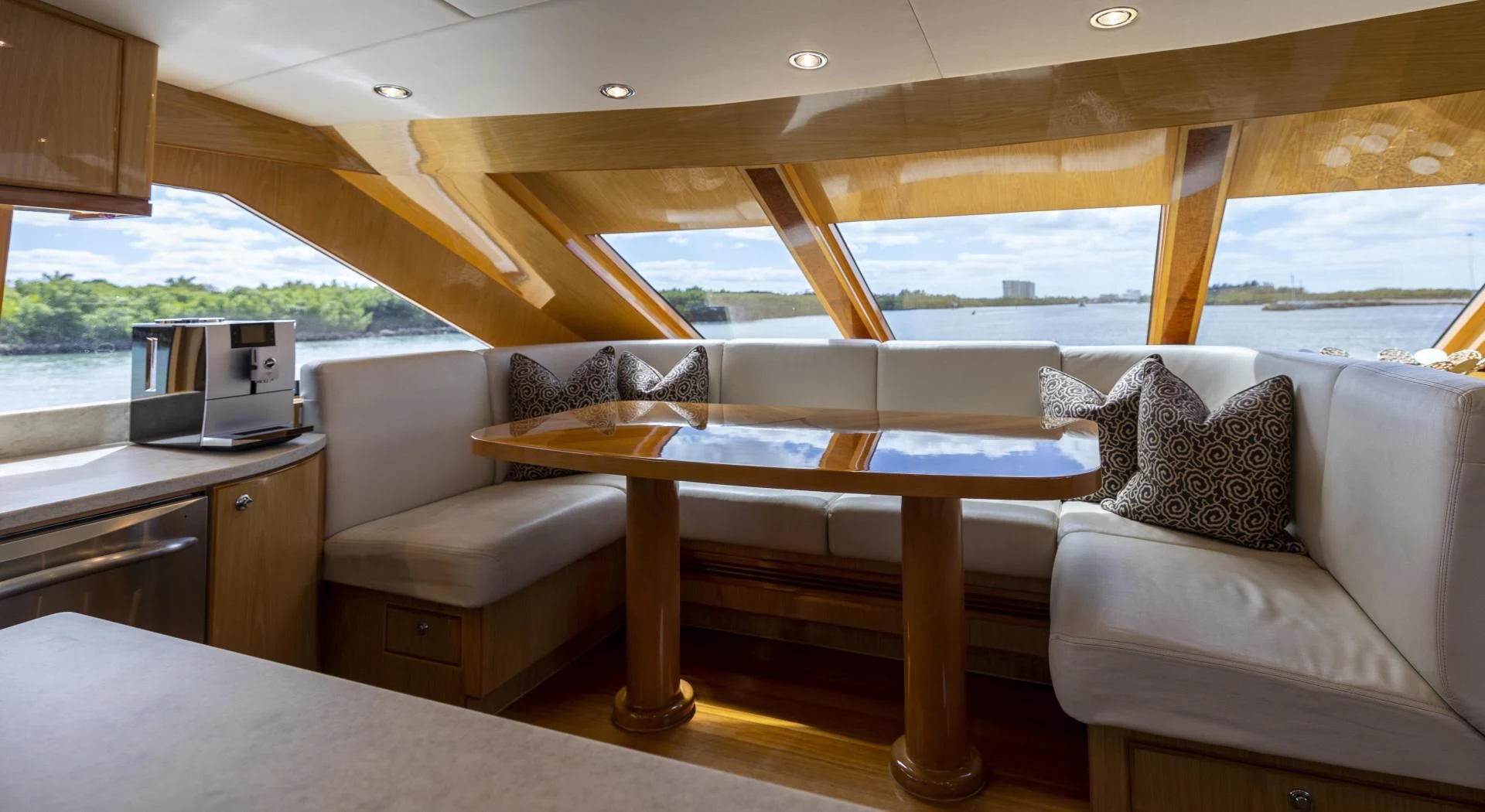 a living room with a couch and a table aboard PINGUINITO Yacht for Sale