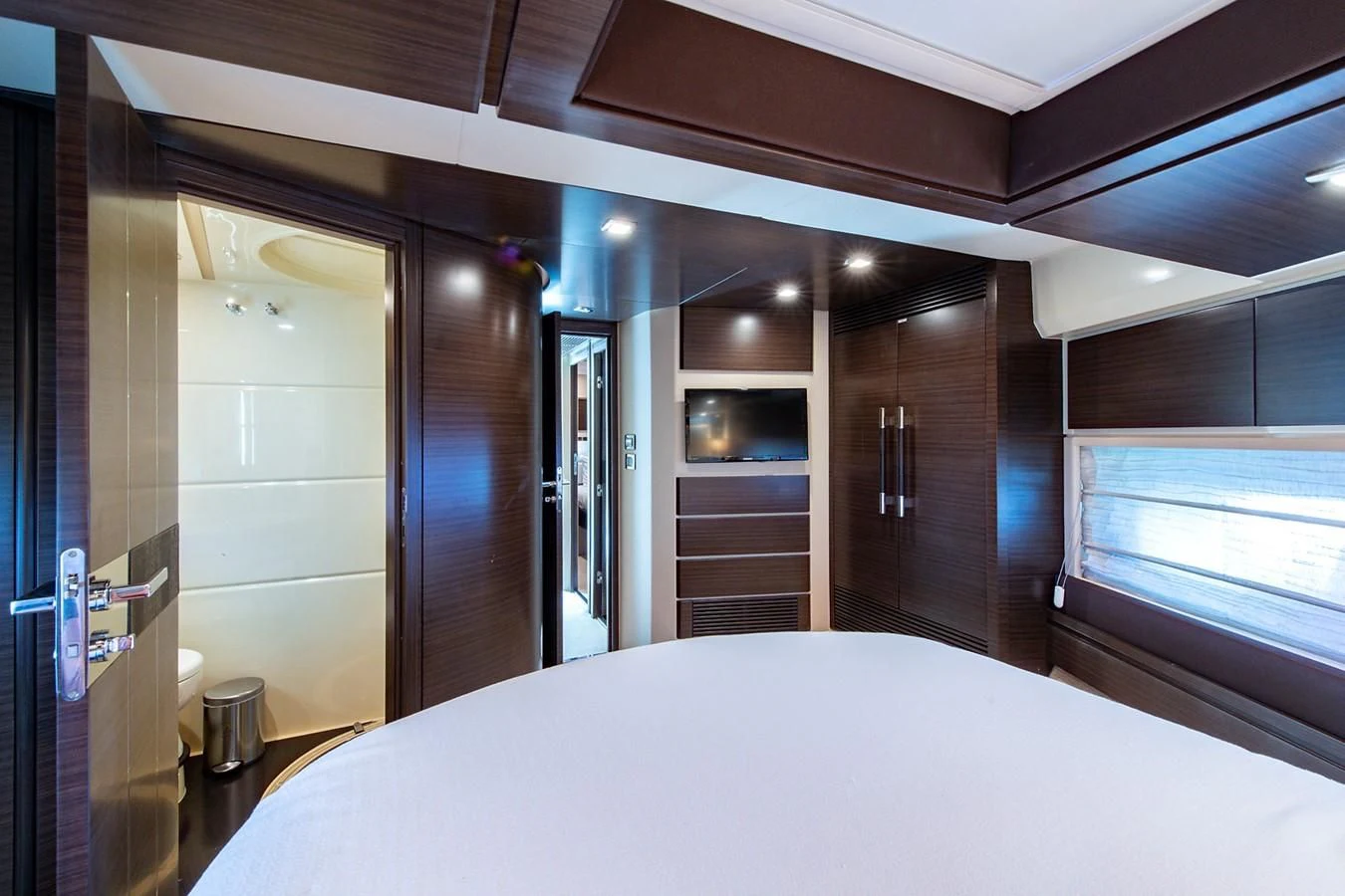 a room with a bed and a mirror aboard SOMEWHERE I BELONG Yacht for Sale