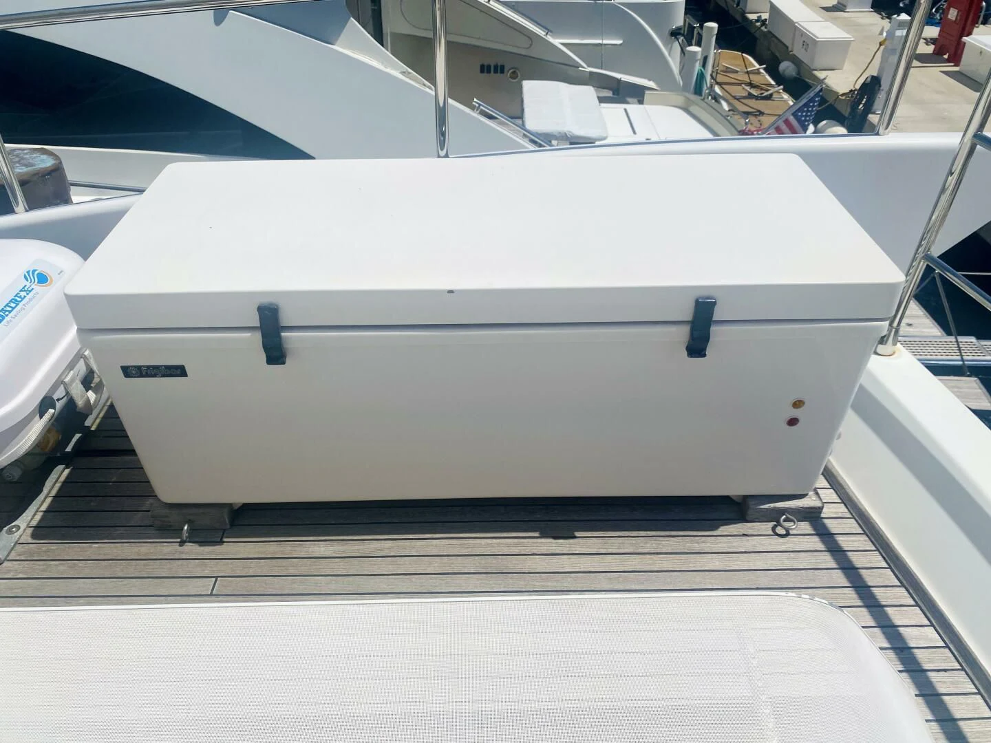 a white rectangular object on a wooden surface aboard SOMEWHERE I BELONG Yacht for Sale