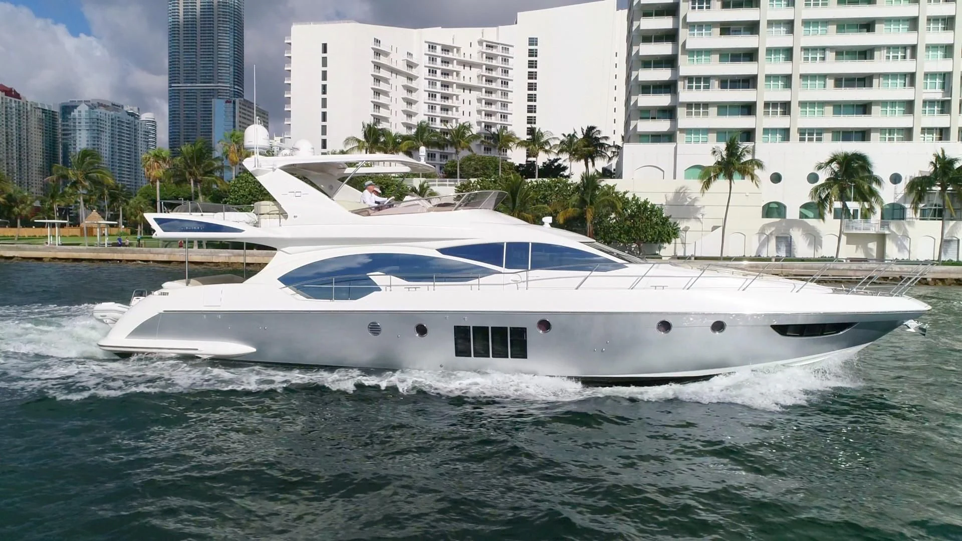 a white yacht in the water aboard SOMEWHERE I BELONG Yacht for Sale