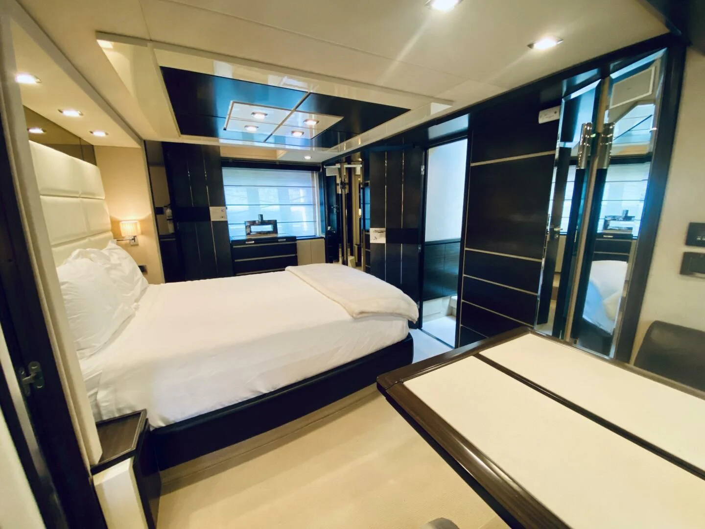 a room with a couple of beds aboard SOMEWHERE I BELONG Yacht for Sale