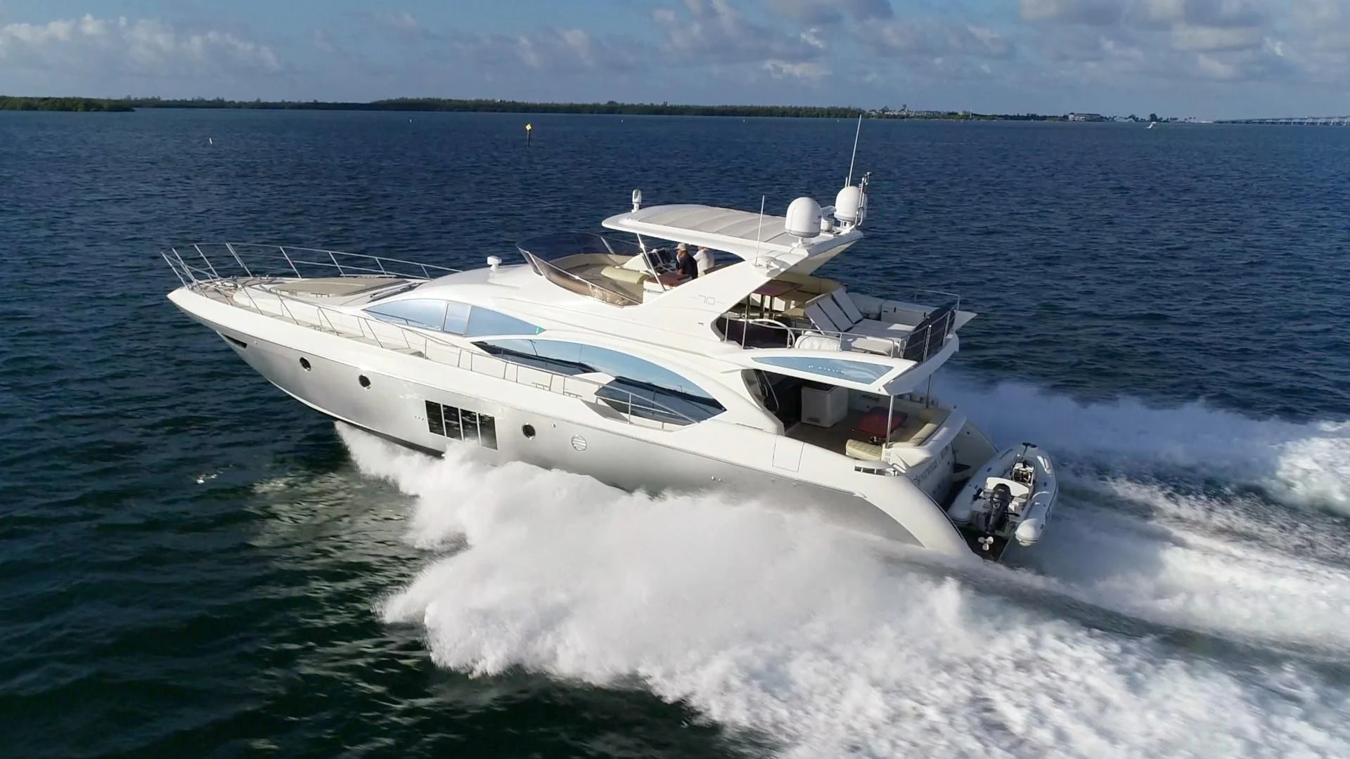 a boat on the water aboard SOMEWHERE I BELONG Yacht for Sale
