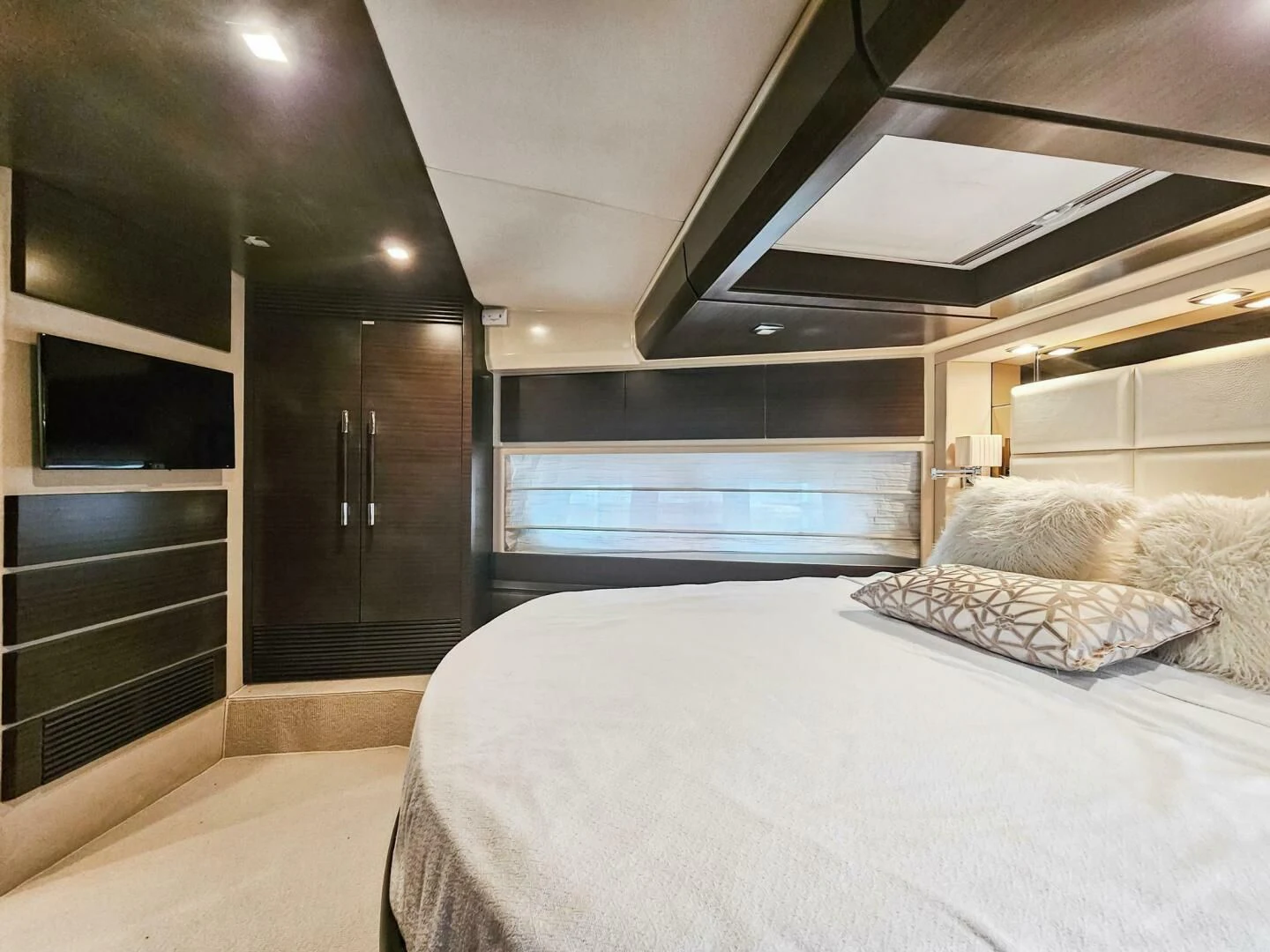 a large bed in a room aboard SOMEWHERE I BELONG Yacht for Sale