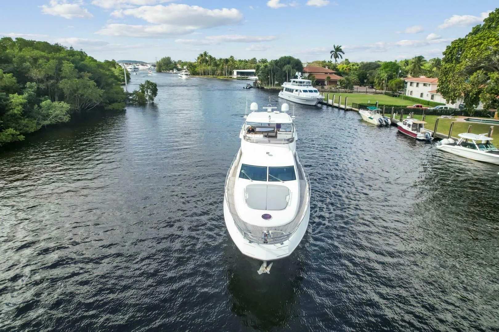 a group of boats on a river aboard SOMEWHERE I BELONG Yacht for Sale