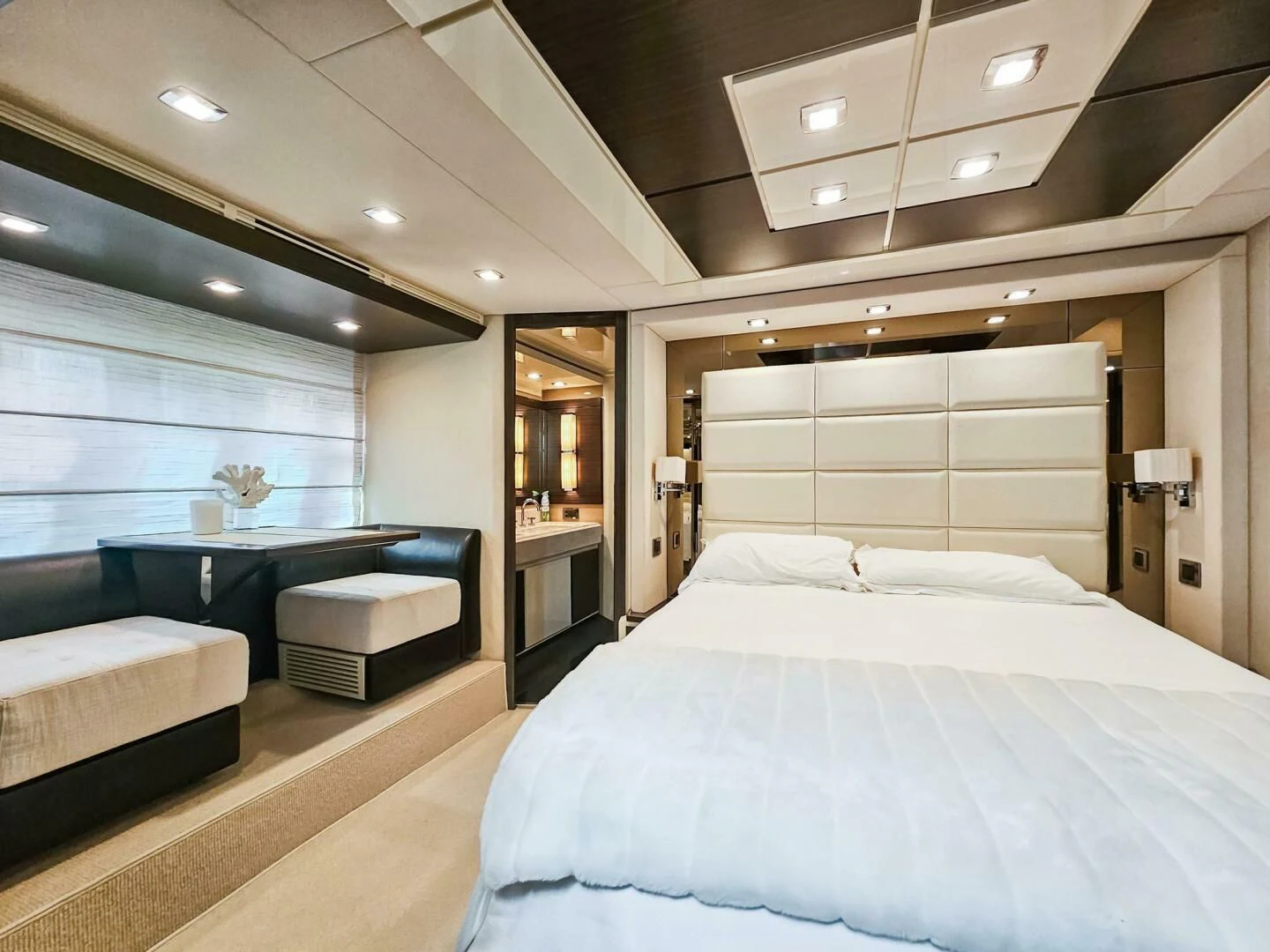 a room with a bed and a table aboard SOMEWHERE I BELONG Yacht for Sale