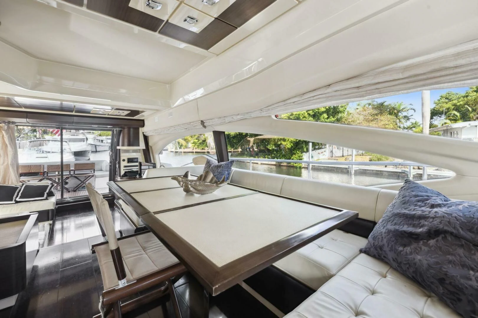 a room with a table and chairs aboard SOMEWHERE I BELONG Yacht for Sale