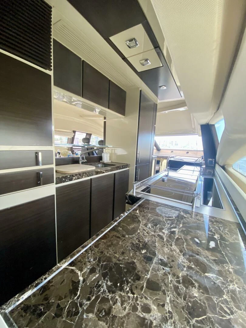 a kitchen with a large counter aboard SOMEWHERE I BELONG Yacht for Sale