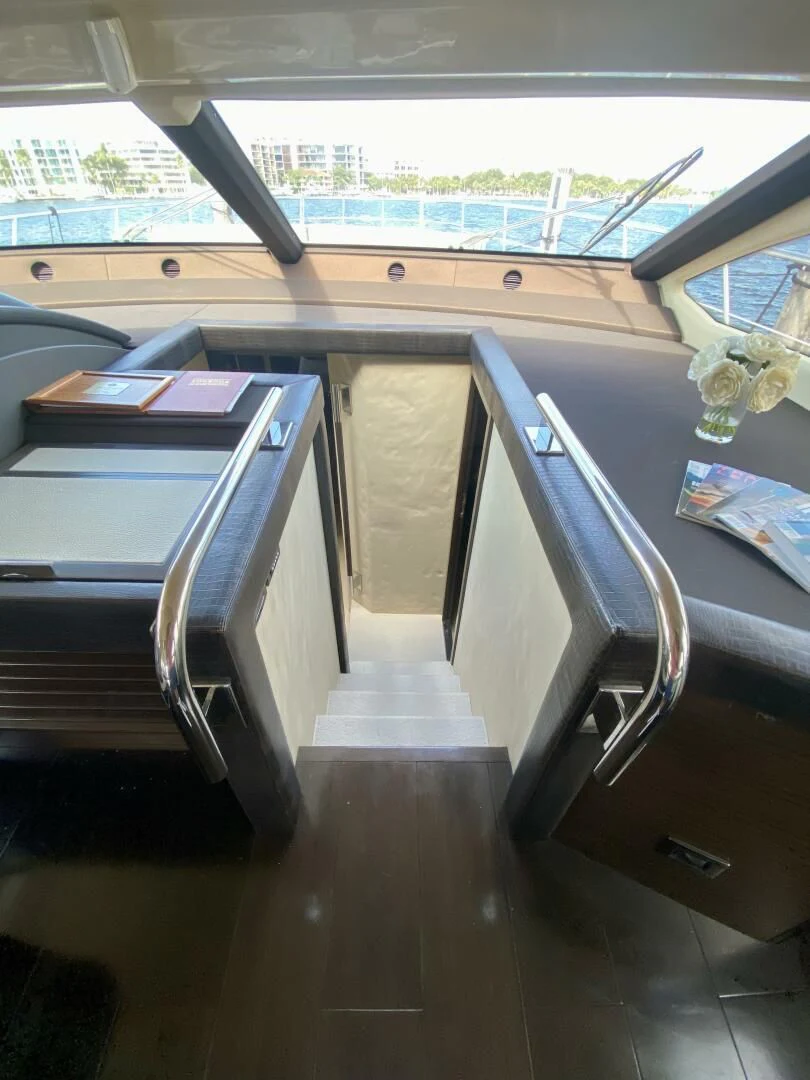 a room with a desk and a window aboard SOMEWHERE I BELONG Yacht for Sale