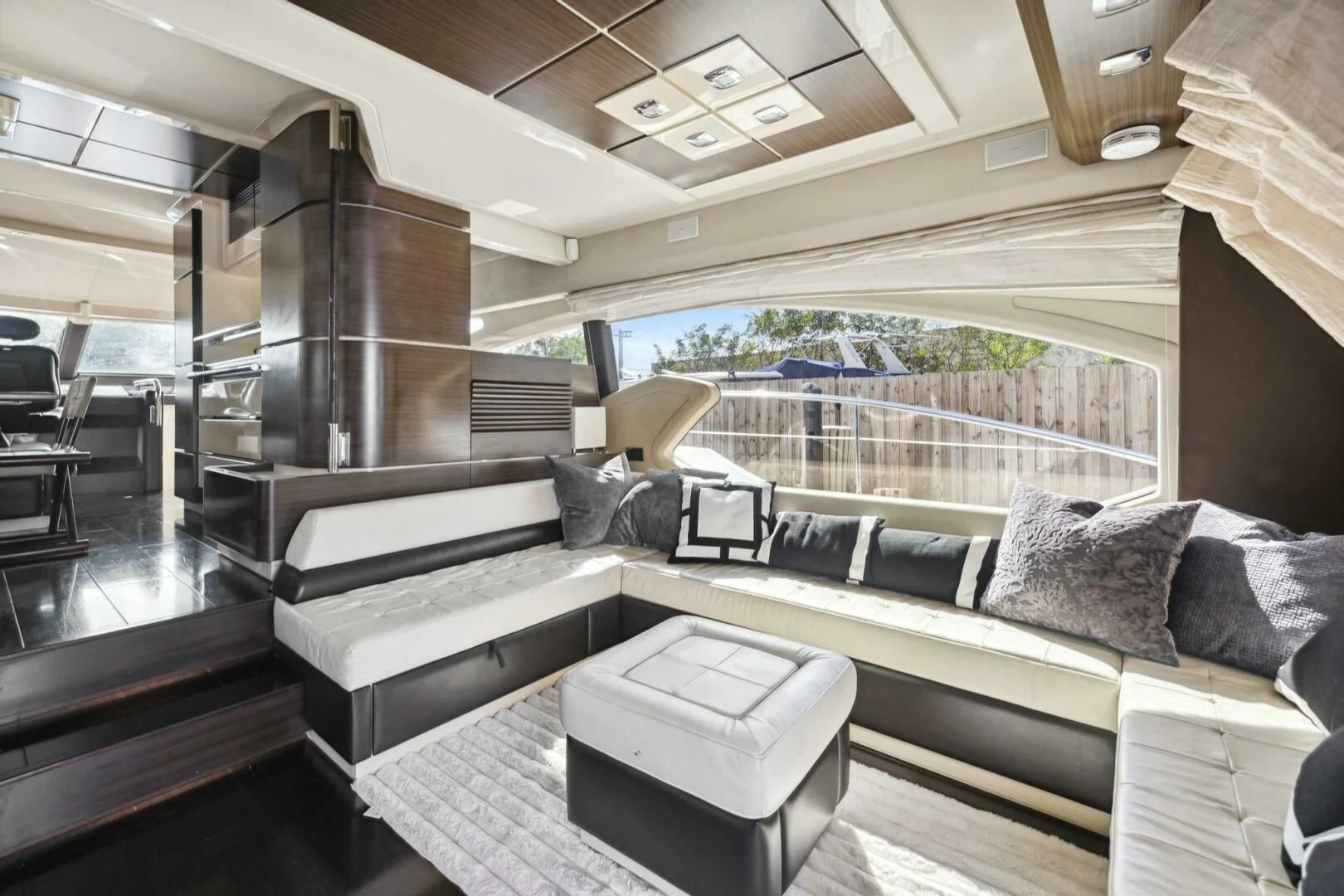 a living room with a large window aboard SOMEWHERE I BELONG Yacht for Sale