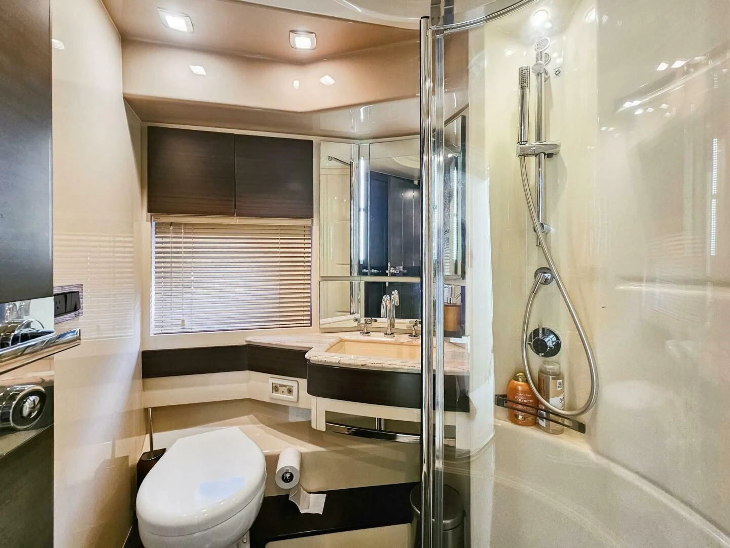 a bathroom with a glass shower aboard SOMEWHERE I BELONG Yacht for Sale