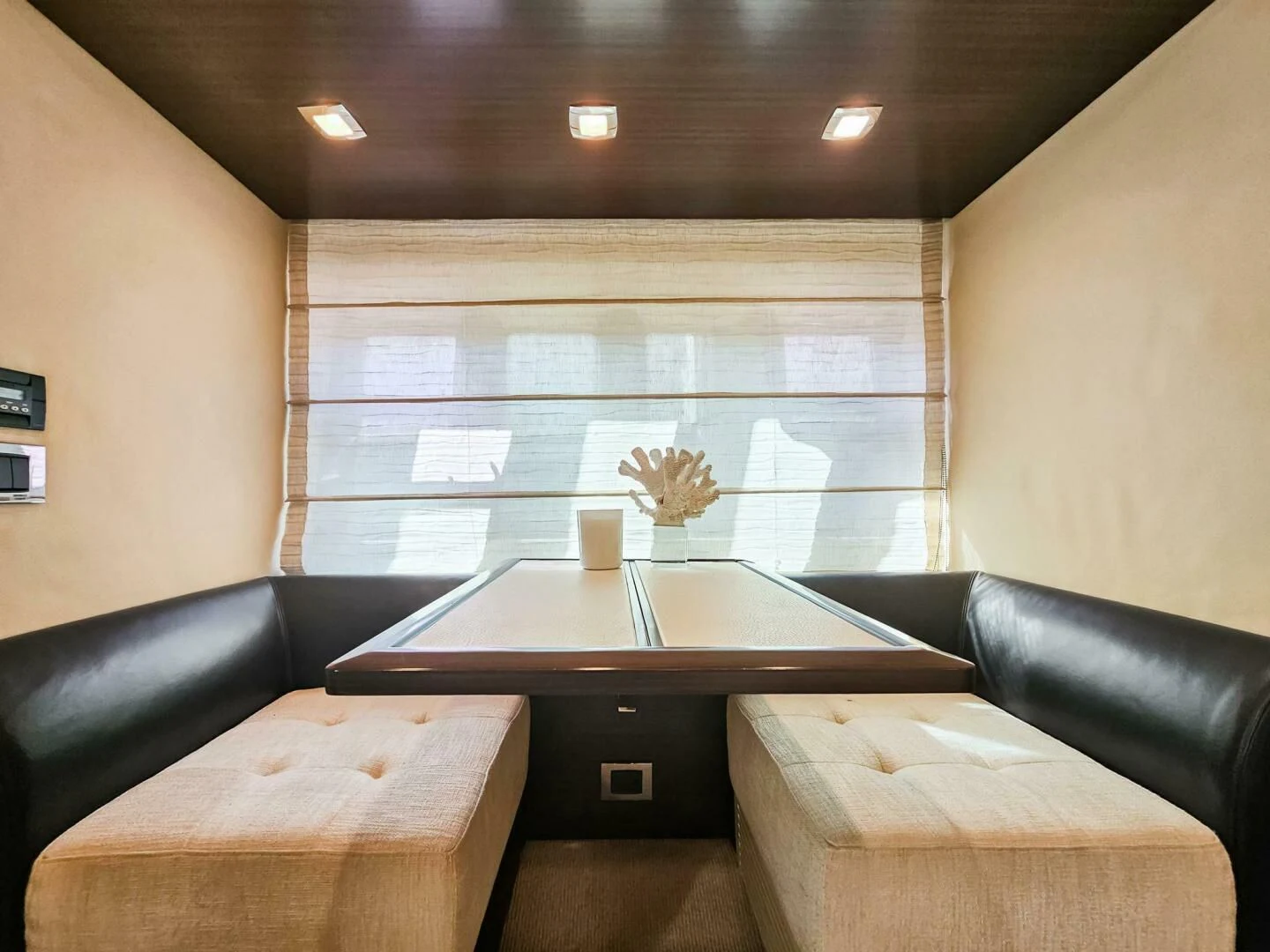 a room with a table and chairs aboard SOMEWHERE I BELONG Yacht for Sale