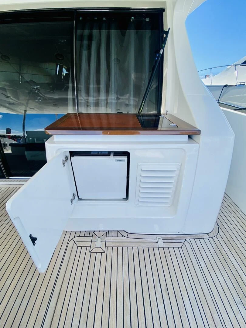 a white vehicle with a vent aboard SOMEWHERE I BELONG Yacht for Sale
