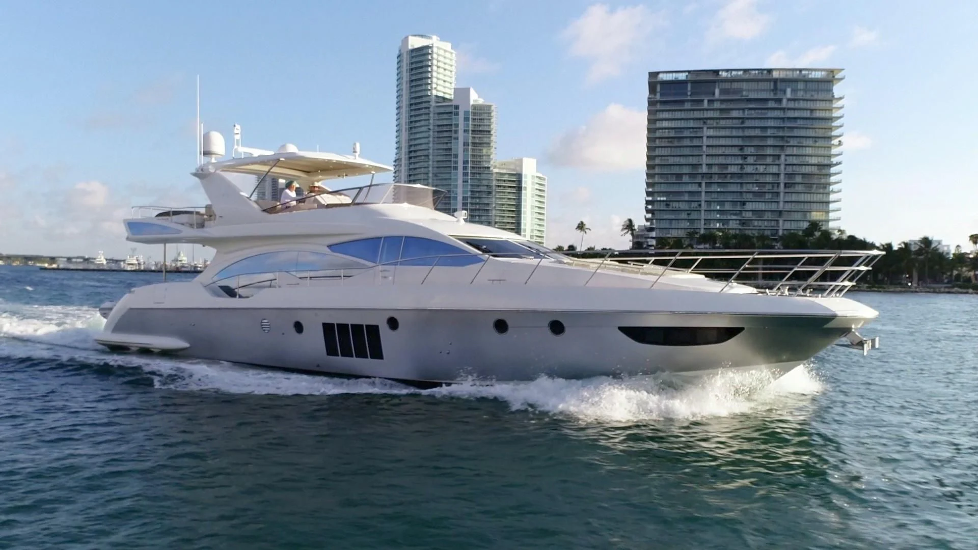 a white yacht in the water aboard SOMEWHERE I BELONG Yacht for Sale