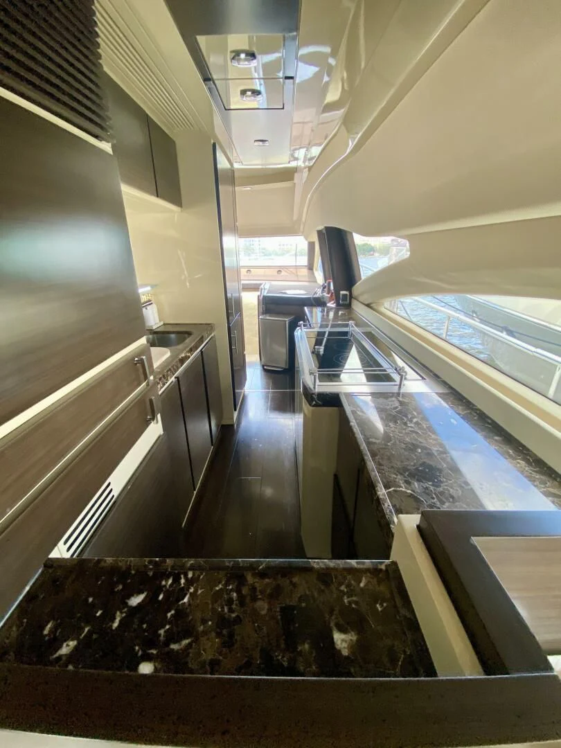 a room with a table and chairs aboard SOMEWHERE I BELONG Yacht for Sale